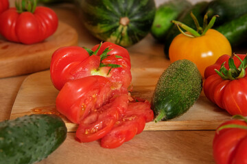 Woman using a knife cutting fresh raw vegetables. Tomatoes, cucumbers being sliced on a wooden board. Cooker at home making a healthy veggie meal. Chopping ingredients for preparing vegetarian dish 4K
