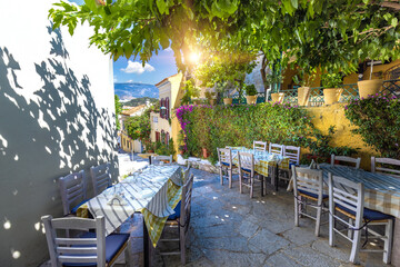 Greece, historic neighborhood of Plaka and Anafiotika in Athens with restaurants near Acropolis. - obrazy, fototapety, plakaty