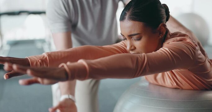 Physiotherapist, exercise ball and athlete training for pain relief, help and health advice from professional. Gym, physical therapy and woman with coach for rehabilitation progress and balance