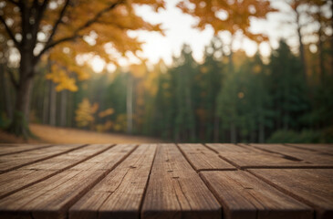 Vue en perspective d'une table en bois avec un fond flou d'arbres en automne  - obrazy, fototapety, plakaty