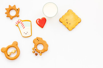 Funny cookies in shape of milk in glass and biscuit with kids toys