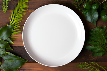 empty white ceramic plate on dark wooden background, top view