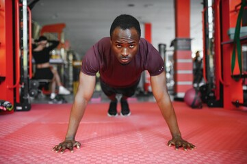 African American young man doing workout at the gym