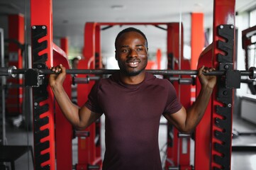 African American young man doing workout at the gym