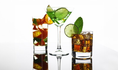 Group cocktail cola with whiskey mojito in a glass print print for skinned kitchen background. Interior bar products home furnishings trendy design black gray gradient sliced fruits and ice.