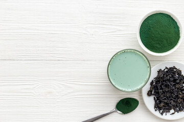 Spirulina algae powder and green latte, top view. Super food concept