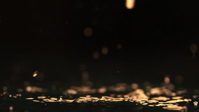 rain background. water droplets, splashes on a black background. slow motion