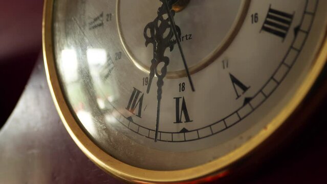 Closeup shot of antique clocking ticking with clock hands showing 6:30