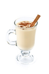 Homemade eggnog with cinnamon. Typical Christmas dessert isolated on white background