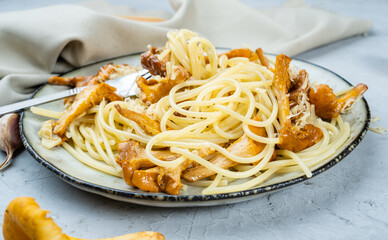 Spaghetti with fried mushrooms and cheese with garlic and herbs, close-up, masta with wild mushrooms