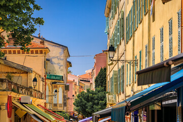 Obraz premium Picturesque colorful traditional houses near the local farmers market in the Old Town, Vieille Ville in Menton, French Riviera, South of France