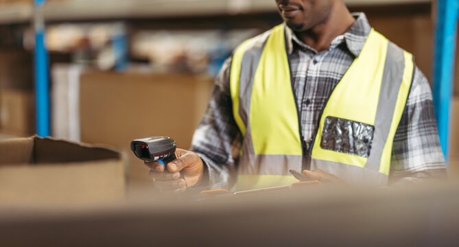 Logistics manager scanning SKU's with a barcode reader