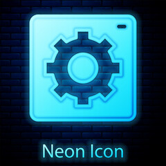 Glowing neon Setting icon isolated on brick wall background. Tools, service, cog, gear, cogwheel sign. Vector