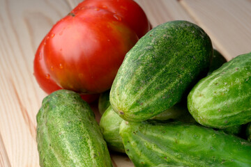 Custom homemade unwashed cucumbers and tomato