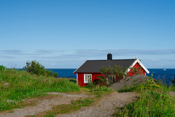 Norway. Fishermans red rorbu cottage in the Lofoten Islands. Typical Scandinavian Fishermans house. now days popular tourist apartments, cottages, rent houses.