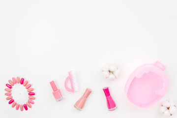 Manicure set with nail tools and palette of nail polish, top view. Beauty cosmetic products