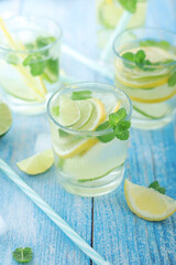 Glasses with lemon and lime lemonade