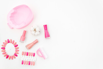 Pink and nude trend colors gel varnishes with manicure and pedicure beauty tools