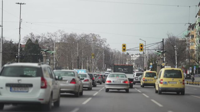 Downtown traffic jam driving through the Sofia city in Bulgaria, slow motion POV