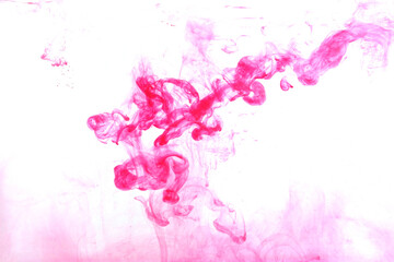 Color dye melt in water on white background,Abstract smoke pattern,Colored liquid dye,Splash paint 