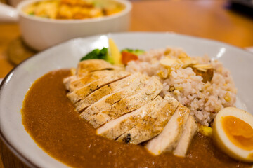 Curry chicken rice dish in restaurant