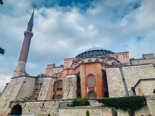 Fototapeta na wymiar Bright summer day the Sofia mosque view at Sultanahmet square in Istanbul city. Turkey