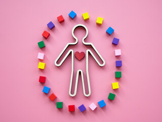 Neurodiversity and autism concept. Human figurine, heart and cubes.