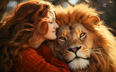 Türaufkleber Portrait of a red-haired girl and a lion © Gromik