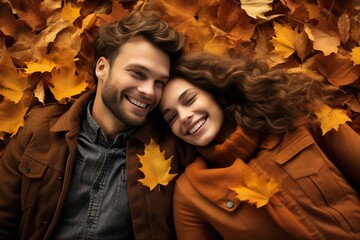 happy couple with autumn leaves