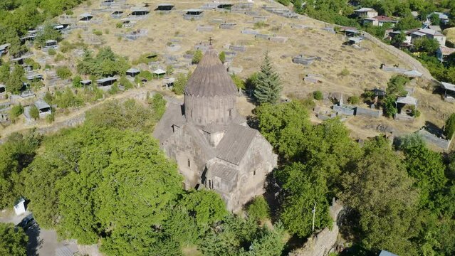 Panoramic drone footage of Surb Astvatsatsin Church on sunny summer day. Bjni village, Kotayk Province, Armenia.