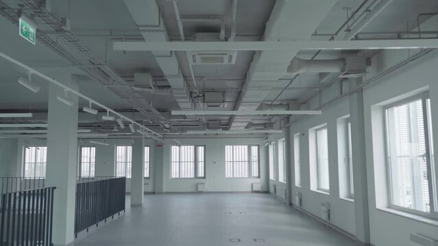 Ventilation pipes inside an empty office building. Gimbal shot