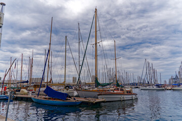 Scenic view of marina with sailing boats and yachts at French City of Toulon on a cloudy late spring day. Photo taken June 9th, 2023, Toulon, France.
