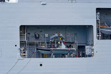 Moored supply warship and tanker of French Navy at Toulon Naval Base on a cloudy spring day. Photo taken June 9th, 2023, Toulon, France.