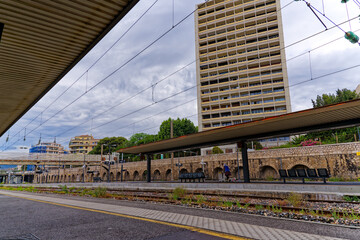 Platform of railway station of French City of Toulon with skyscraper in the background on a cloudy late spring day. Photo taken June 9th, 2023, Toulon, France.