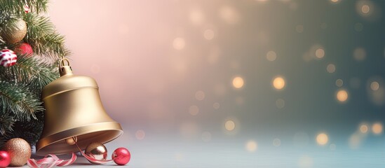 Colorful bell shaped Christmas decorations hanging from the branches of a Christmas tree isolated pastel background Copy space