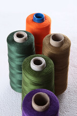 Colorful yarn on spool, yarn on tube, cotton, wool, linen thread.Knitting and hobbies.
