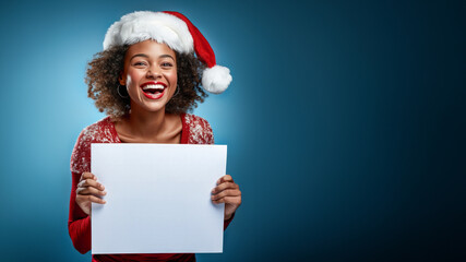 Smiling black Woman Holding a blank Sign wearing Santa Claus Costume and hat