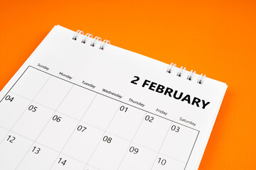 The February 2024 month calendar on orange color cover background. Monthly calendar concepts.