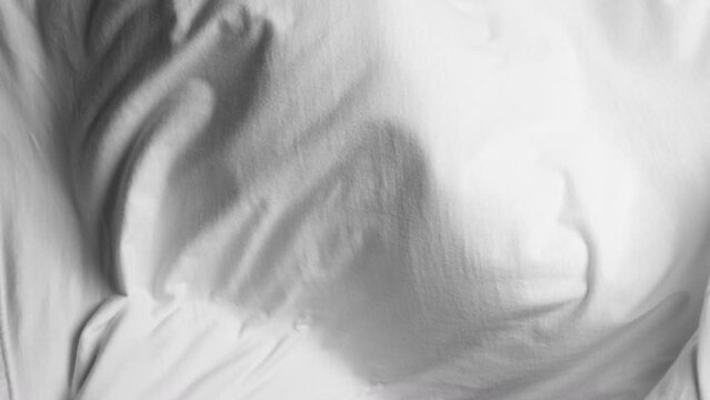 White fabric blowing in slow motion