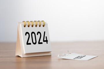 2024 Happy New year background. Turns over a calendar sheet. Setup objective target business cost...