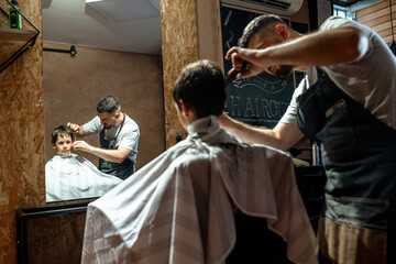 Little boy at hairdresser 
