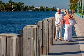 Happy Senior Couple Walking By The Sea in Tropical Resort - 646413395