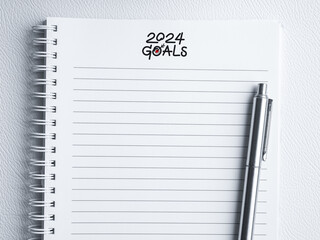 Goal, action and plan, resolution concept in new year 2024. Text, 2024 GOALS, handwriting with...