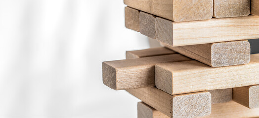 Wooden block balancing tower. Business strategy, insurance and planning concepts.