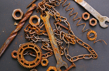 old rusty repair tools on black background. Background of old rusty tools. The concept of workshop or repair 