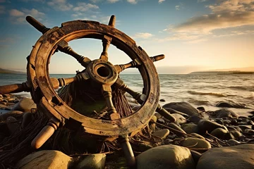 Papier Peint photo Lavable Navire old rusty ship wheel on the shore