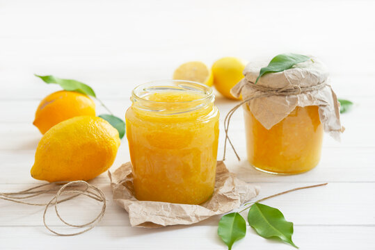 Freshly made homemade lemon jam in glass jars.