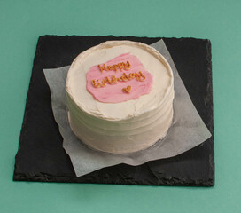 colored cakes with cream and various inscriptions