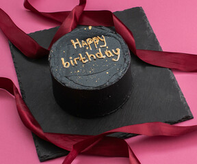 colored cakes with cream and various inscriptions