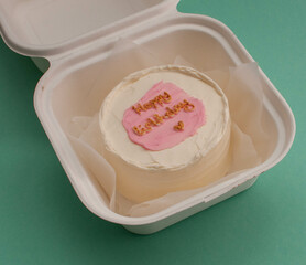 colored cakes with cream and various inscriptions